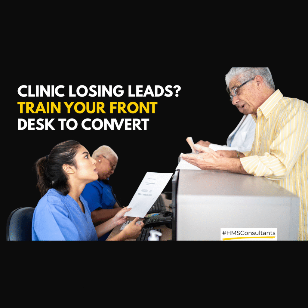 Receptionist attending a patient call at a clinic front desk